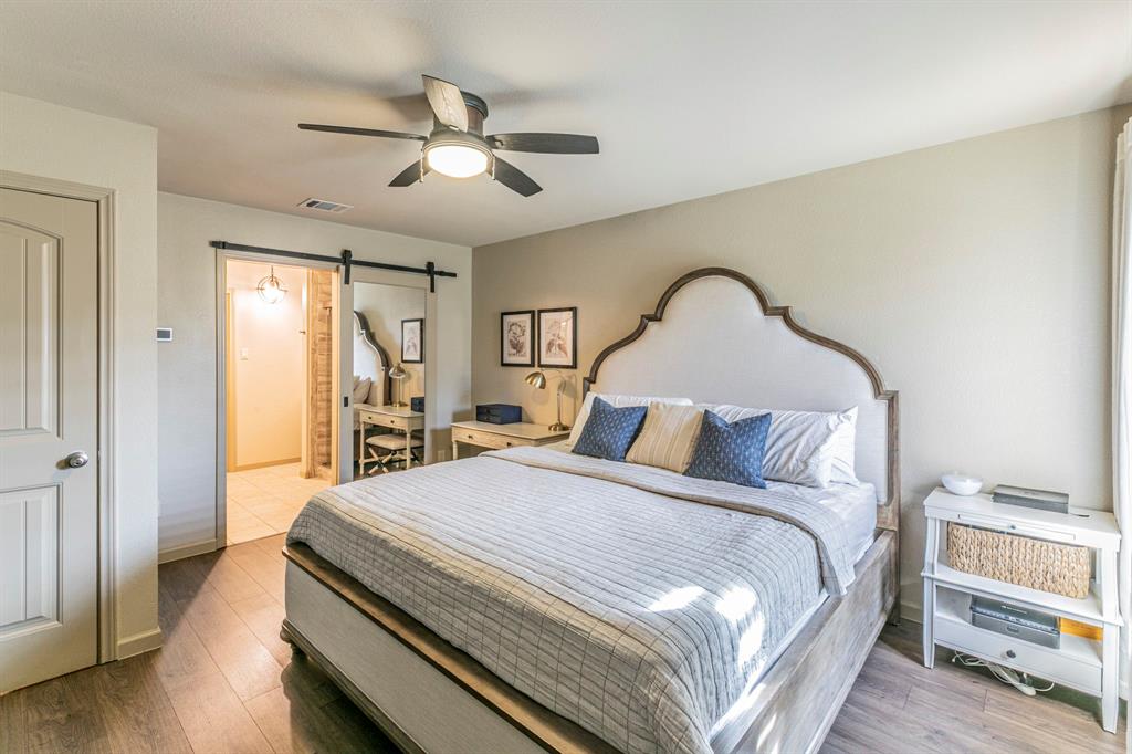 2210 Torch Lake Drive Forney, TX 75126 - Photo 10 of 29 a bedroom with bed and wooden floor