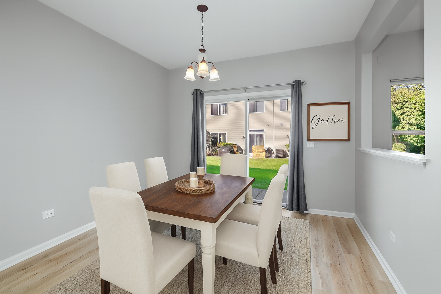 17694 Gilbert Drive Lockport, IL 60441 - Photo 13 of 29 a view of a dining room with furniture window and wooden floor