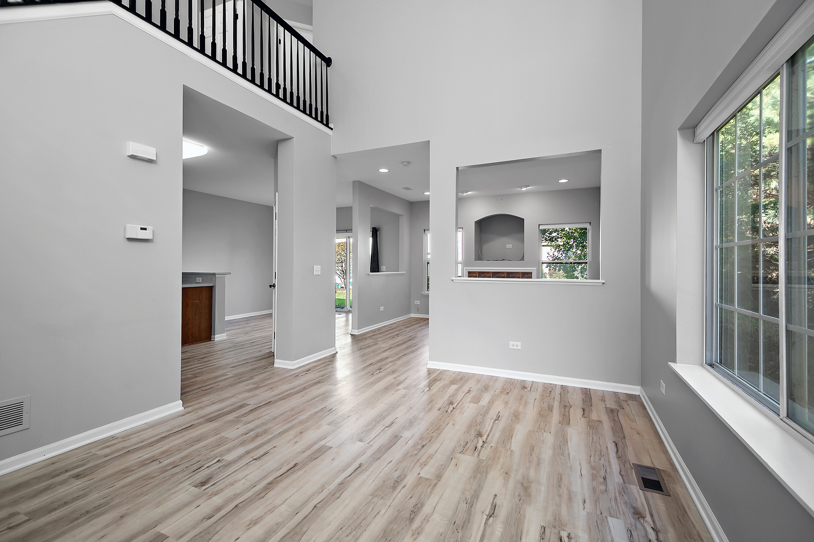 17694 Gilbert Drive Lockport, IL 60441 - Photo 14 of 29 a view of a hallway view with wooden floor and a living room