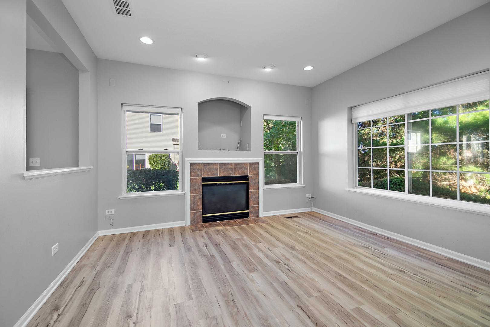 17694 Gilbert Drive Lockport, IL 60441 - Photo 15 of 29 a view of an empty room with a window and fireplace