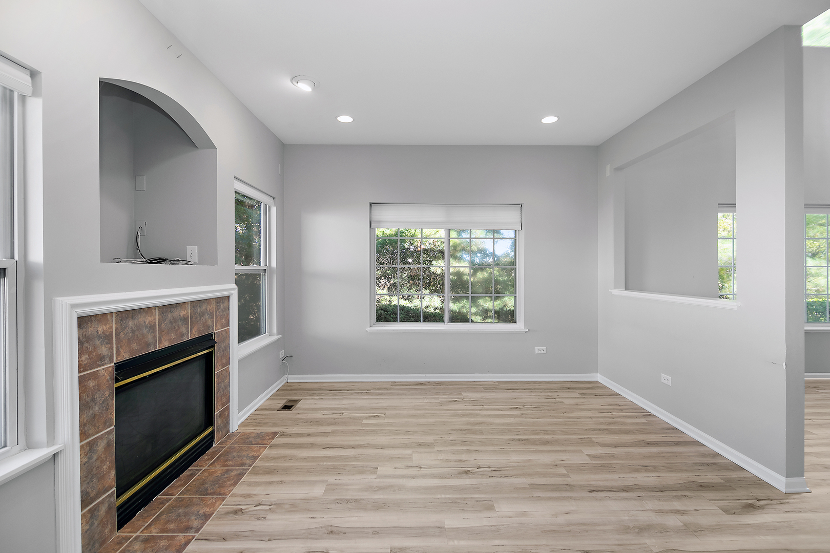 17694 Gilbert Drive Lockport, IL 60441 - Photo 16 of 29 an empty room with windows and fireplace