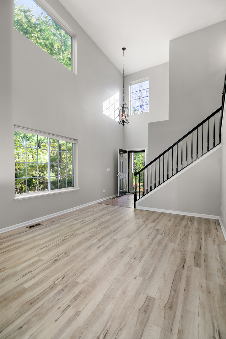 17694 Gilbert Drive Lockport, IL 60441 - Photo 18 of 29 a view of an empty room with wooden floor and a window