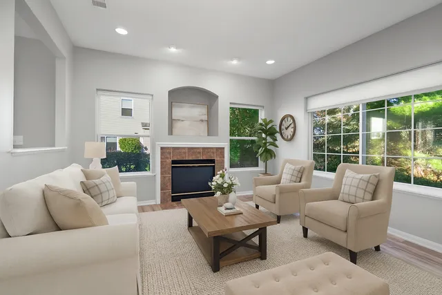 a living room with furniture and a fireplace