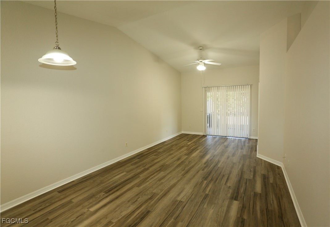 4612 25th Street Southwest Lehigh Acres, FL 33973 - Photo 3 of 15 a view of empty room with wooden floor and fan