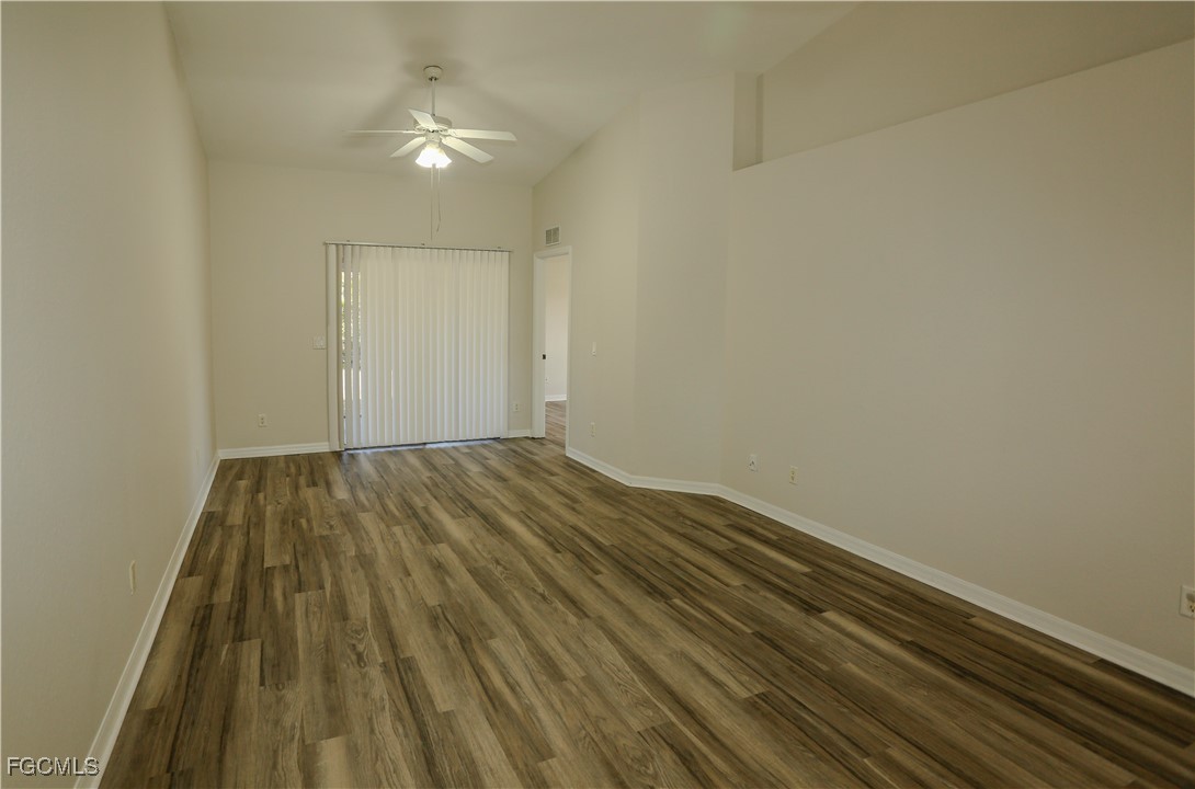 4612 25th Street Southwest Lehigh Acres, FL 33973 - Photo 5 of 15 a view of a room with wooden floor and fan