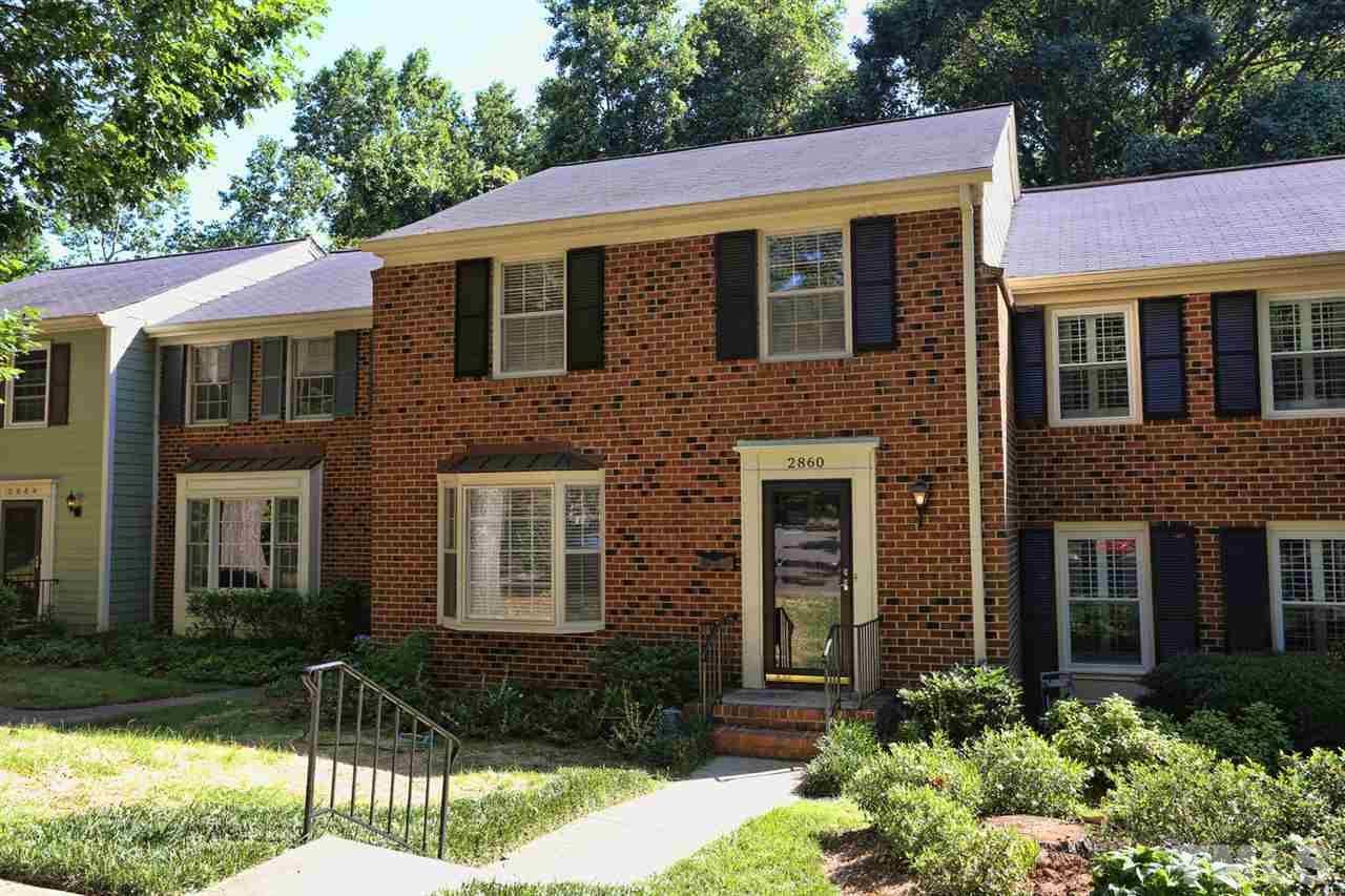 2860 Wycliff Road Raleigh, NC 27607 - Photo 1 of 25 a front view of a house with a yard
