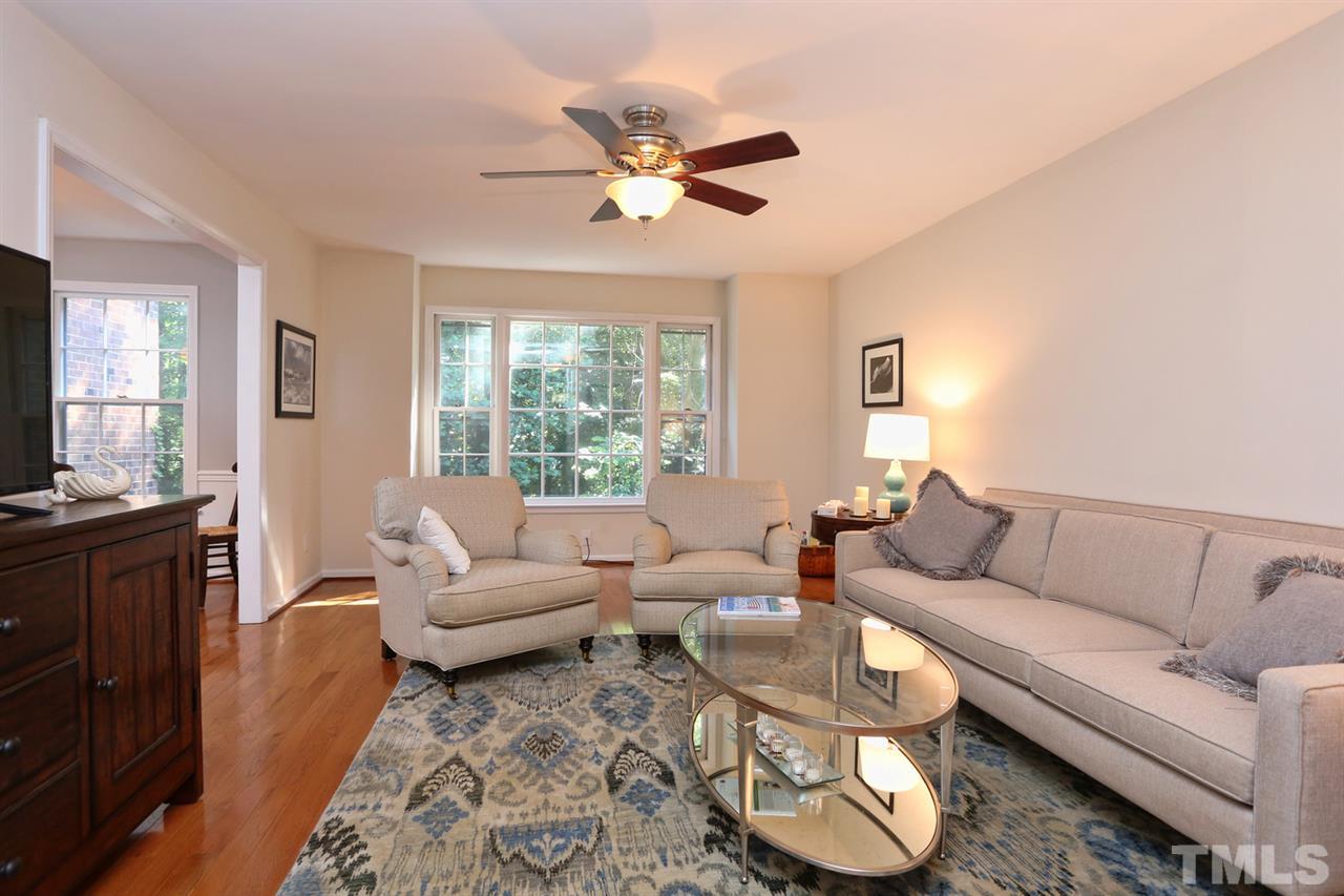 2860 Wycliff Road Raleigh, NC 27607 - Photo 2 of 25 a living room with furniture and a large window