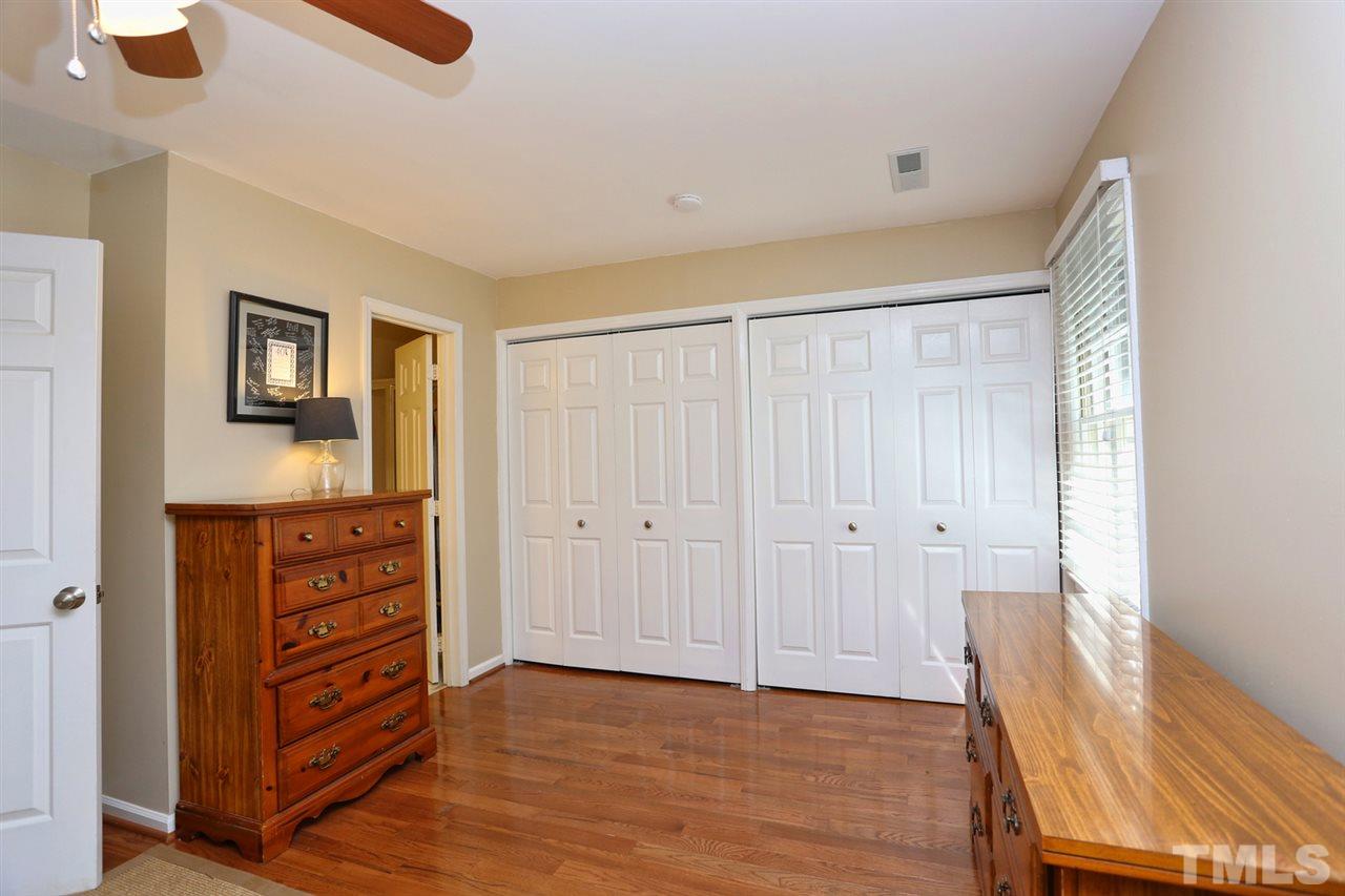 2860 Wycliff Road Raleigh, NC 27607 - Photo 12 of 25 a view of walk in closet with furniture and wooden floor