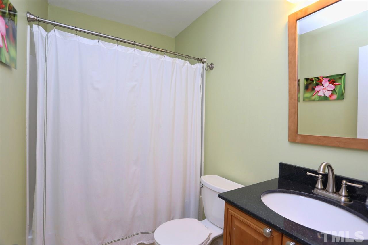 2860 Wycliff Road Raleigh, NC 27607 - Photo 15 of 25 a bathroom with a sink vanity mirror and toilet