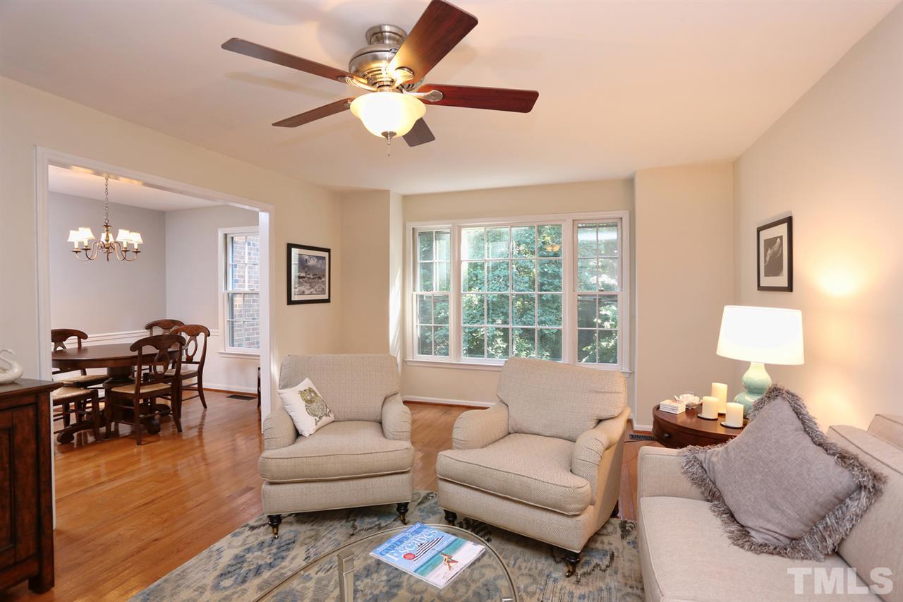 2860 Wycliff Road Raleigh, NC 27607 - Photo 3 of 25 a living room with furniture and a large window