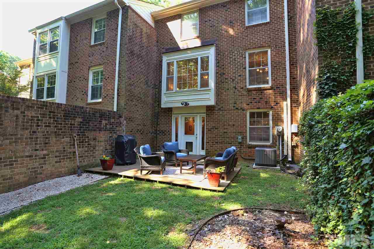 2860 Wycliff Road Raleigh, NC 27607 - Photo 22 of 25 a backyard of a house with a garden and barbeque oven