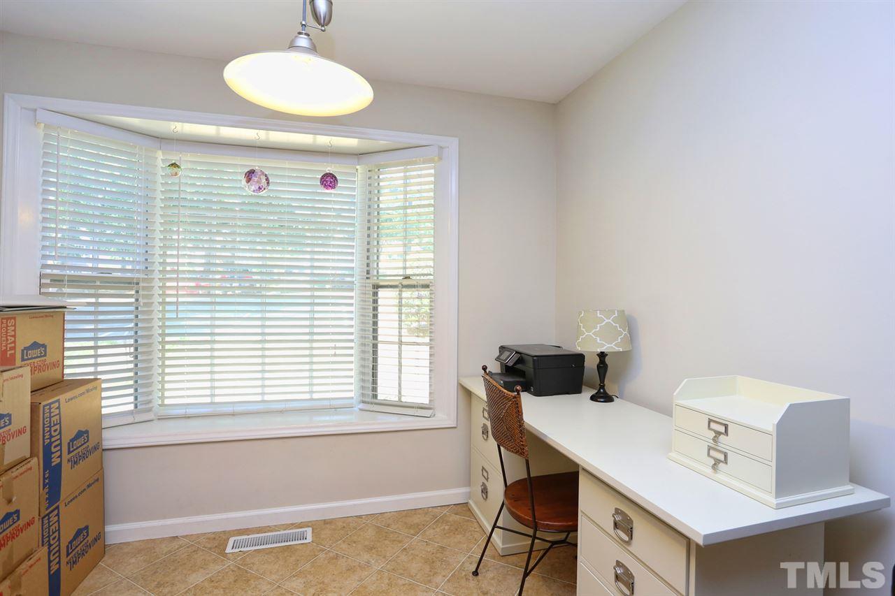 2860 Wycliff Road Raleigh, NC 27607 - Photo 6 of 25 a view of a workspace with furniture and a window