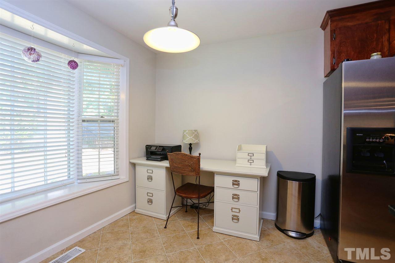 2860 Wycliff Road Raleigh, NC 27607 - Photo 7 of 25 a room with cabinets and washer dryer