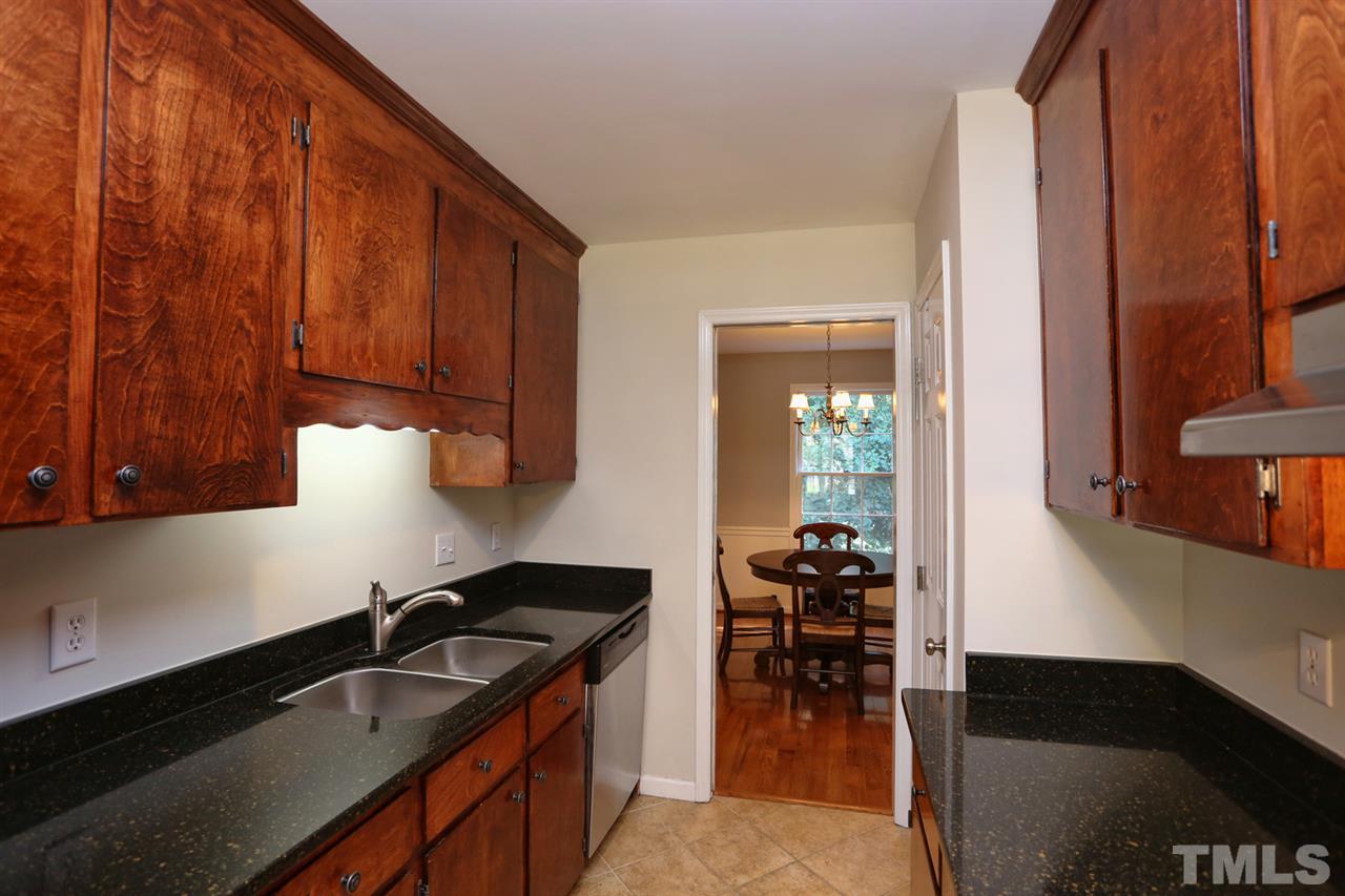 2860 Wycliff Road Raleigh, NC 27607 - Photo 8 of 25 a kitchen with a sink and cabinets