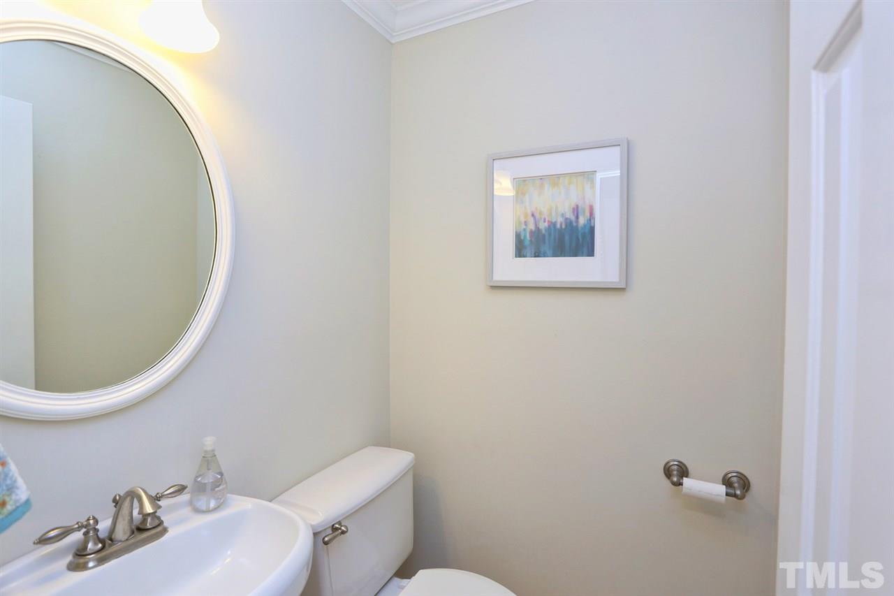 2860 Wycliff Road Raleigh, NC 27607 - Photo 10 of 25 a bathroom with a toilet and a sink