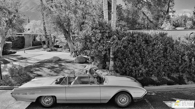 a car parked in front of a house