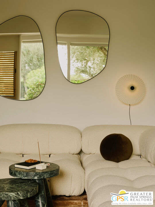 360 Cabrillo Road, Unit 101 Palm Springs, CA 92262 - Photo 11 of 39 a room with a table and chairs