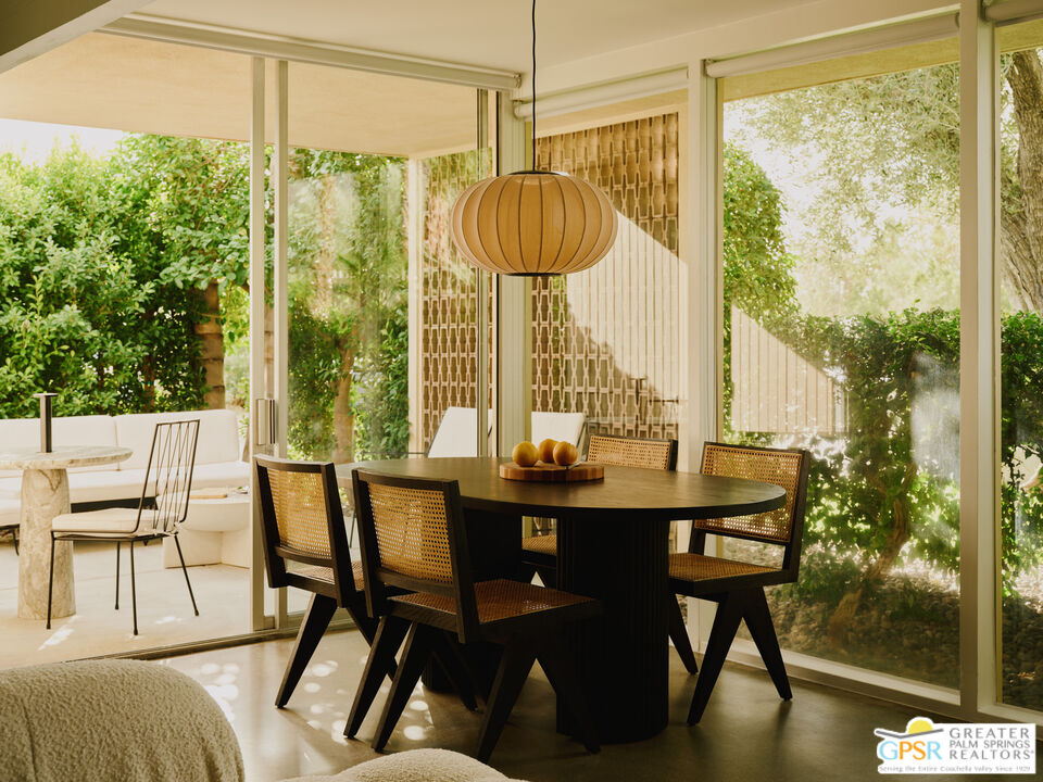 360 Cabrillo Road, Unit 101 Palm Springs, CA 92262 - Photo 14 of 39 a view of a dining room with furniture window and outside view