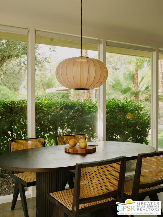 360 Cabrillo Road, Unit 101 Palm Springs, CA 92262 - Photo 15 of 39 a table and chairs in a balcony
