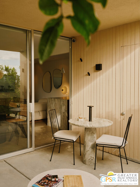 360 Cabrillo Road, Unit 101 Palm Springs, CA 92262 - Photo 16 of 39 a living room with patio furniture