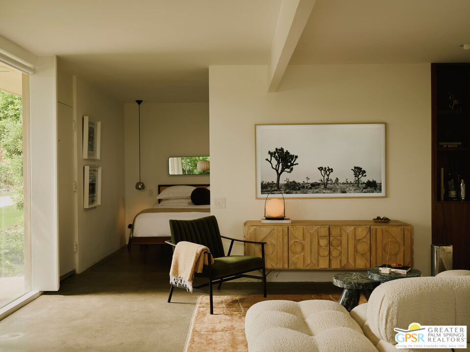 360 Cabrillo Road, Unit 101 Palm Springs, CA 92262 - Photo 18 of 39 a living room with furniture and a window