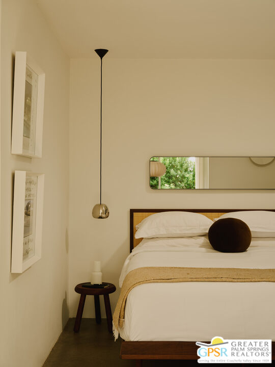 360 Cabrillo Road, Unit 101 Palm Springs, CA 92262 - Photo 19 of 39 a bedroom with a bed and a window