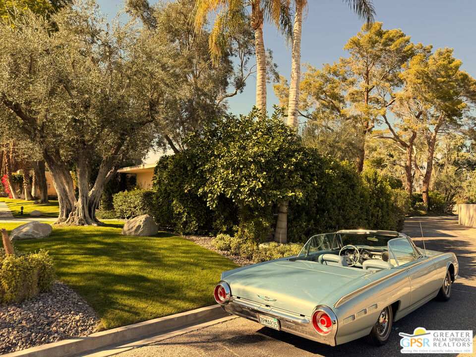 360 Cabrillo Road, Unit 101 Palm Springs, CA 92262 - Photo 2 of 39 a car parked on the side of the road