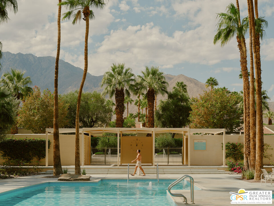 360 Cabrillo Road, Unit 101 Palm Springs, CA 92262 - Photo 27 of 39 a view of a swimming pool with a garden