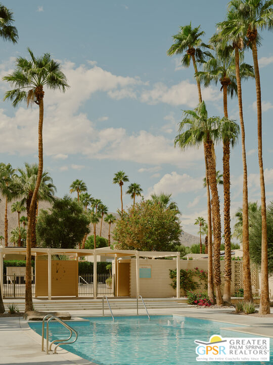 360 Cabrillo Road, Unit 101 Palm Springs, CA 92262 - Photo 28 of 39 a view of a swimming pool and a yard