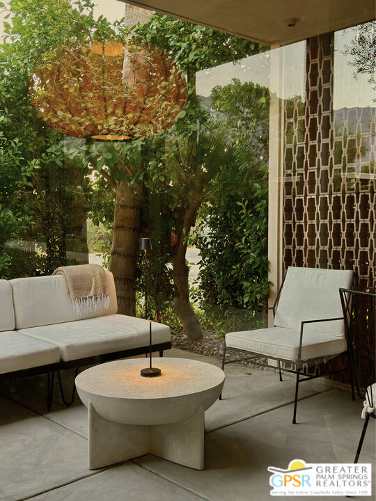 360 Cabrillo Road, Unit 101 Palm Springs, CA 92262 - Photo 8 of 39 a outdoor space with patio the couches and a dining table with garden view