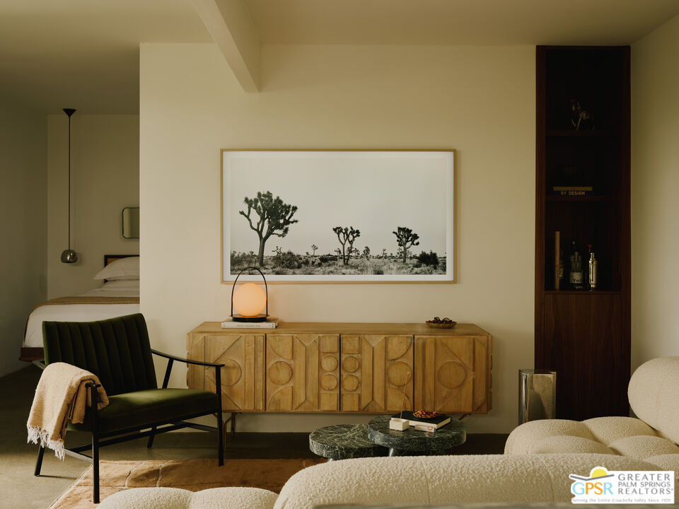 360 Cabrillo Road, Unit 101 Palm Springs, CA 92262 - Photo 9 of 39 a living room with furniture and a painting on the wall