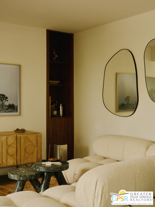 360 Cabrillo Road, Unit 101 Palm Springs, CA 92262 - Photo 10 of 39 a bedroom with a bed and a mirror