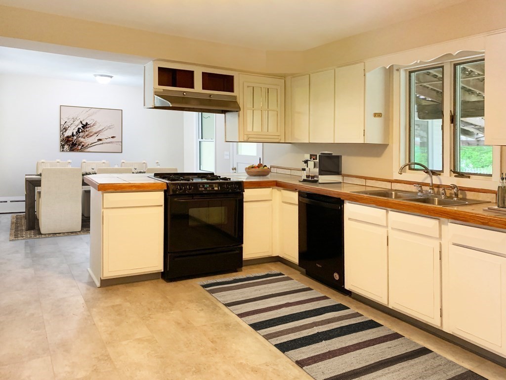 3 Sasur Street Three Rivers, MA 01080 - Photo 4 of 35 a kitchen with a stove and a sink