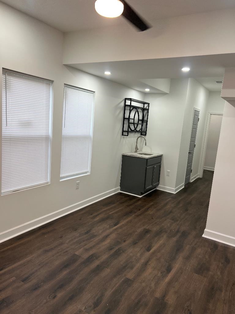 56 South Sanga Road Cordova, TN 38018 - Photo 13 of 26 Unfurnished dining area featuring dark wood-style floors, a ceiling fan, and recessed lighting