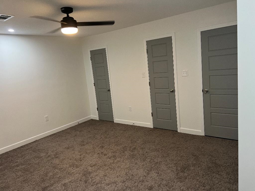 56 South Sanga Road Cordova, TN 38018 - Photo 14 of 26 Unfurnished bedroom featuring dark colored carpet and ceiling fan