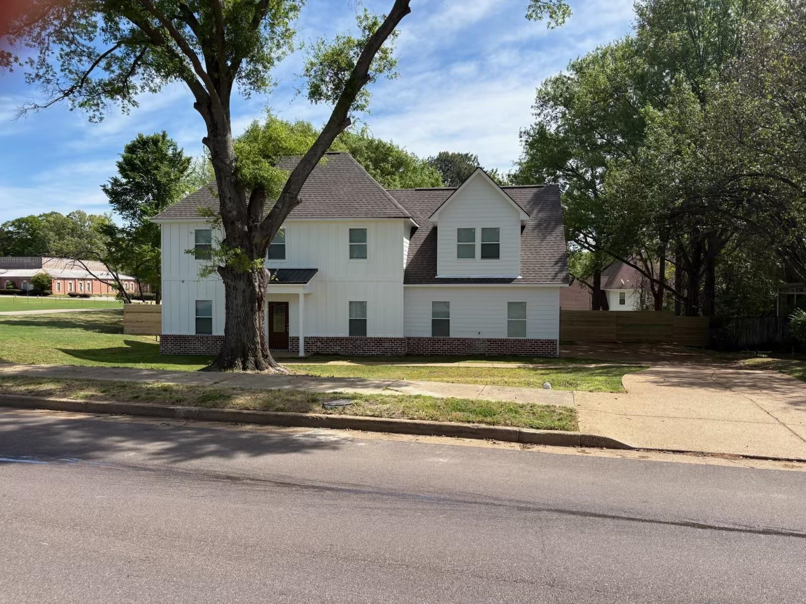 56 South Sanga Road Cordova, TN 38018 - Photo 24 of 26 View of front of home featuring a shingled roof and board and batten siding