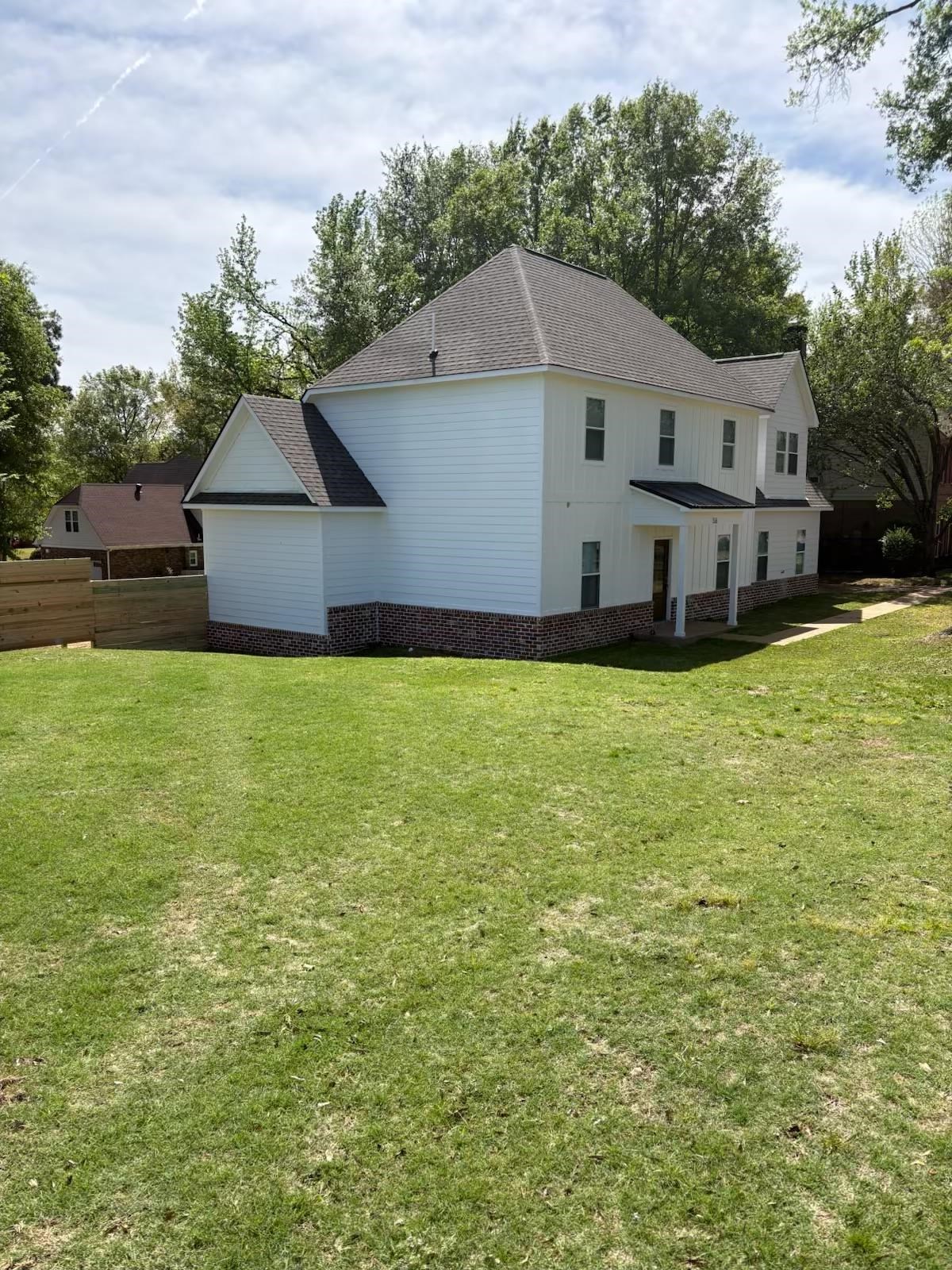 56 South Sanga Road Cordova, TN 38018 - Photo 25 of 26 View of side of property featuring a shingled roof