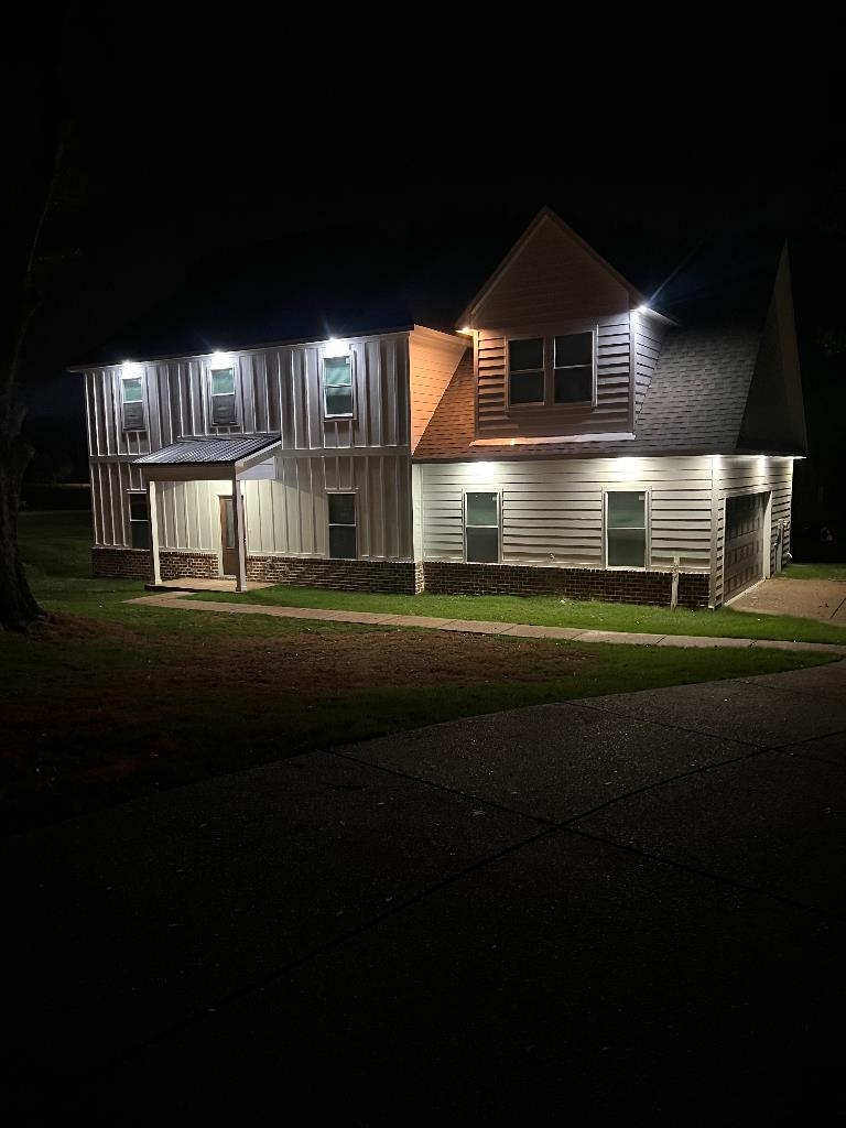 56 South Sanga Road Cordova, TN 38018 - Photo 3 of 26 Modern farmhouse style home featuring a yard, driveway, covered porch, and a garage
