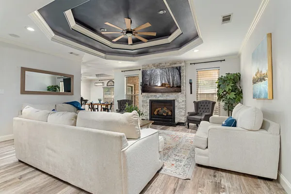 a living room with furniture and a fireplace