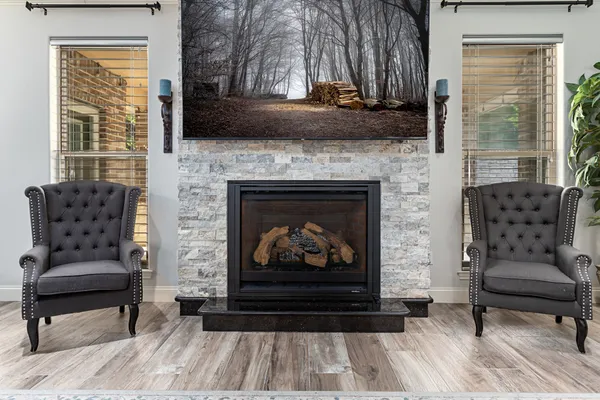 a living room with furniture and a fireplace