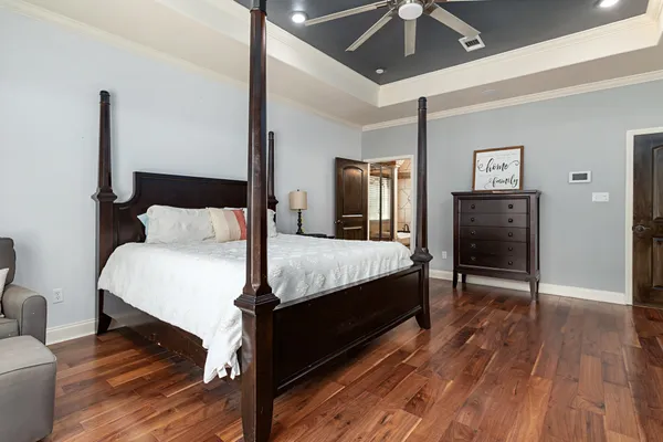 a bedroom with a bed and a walk in closet