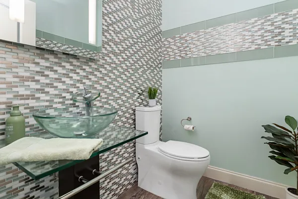 a bathroom with a toilet and a sink