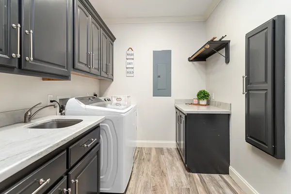 a kitchen with a sink and refrigerator