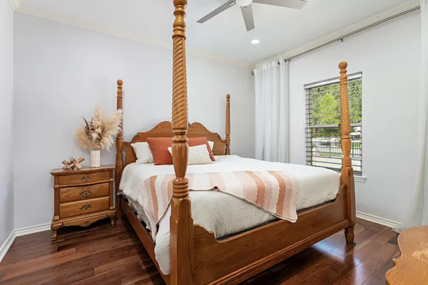 a bed room with a bed and a window