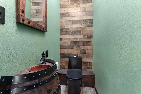 a bathroom with a toilet and a shower