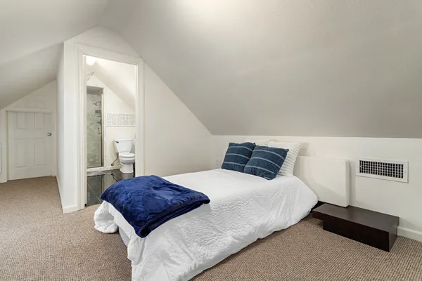 a bedroom with a bed and a cabinets