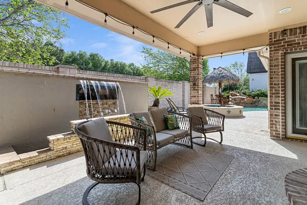 a roof deck with table and chairs