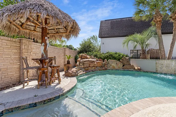 a view of a backyard with a patio