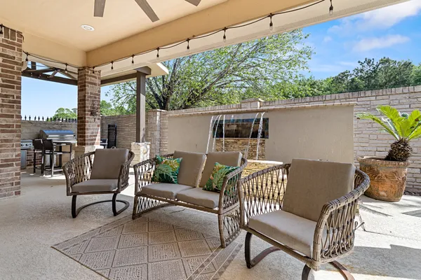 a balcony with furniture and a potted plant