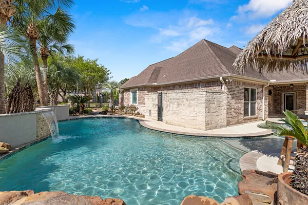 a view of house with a yard